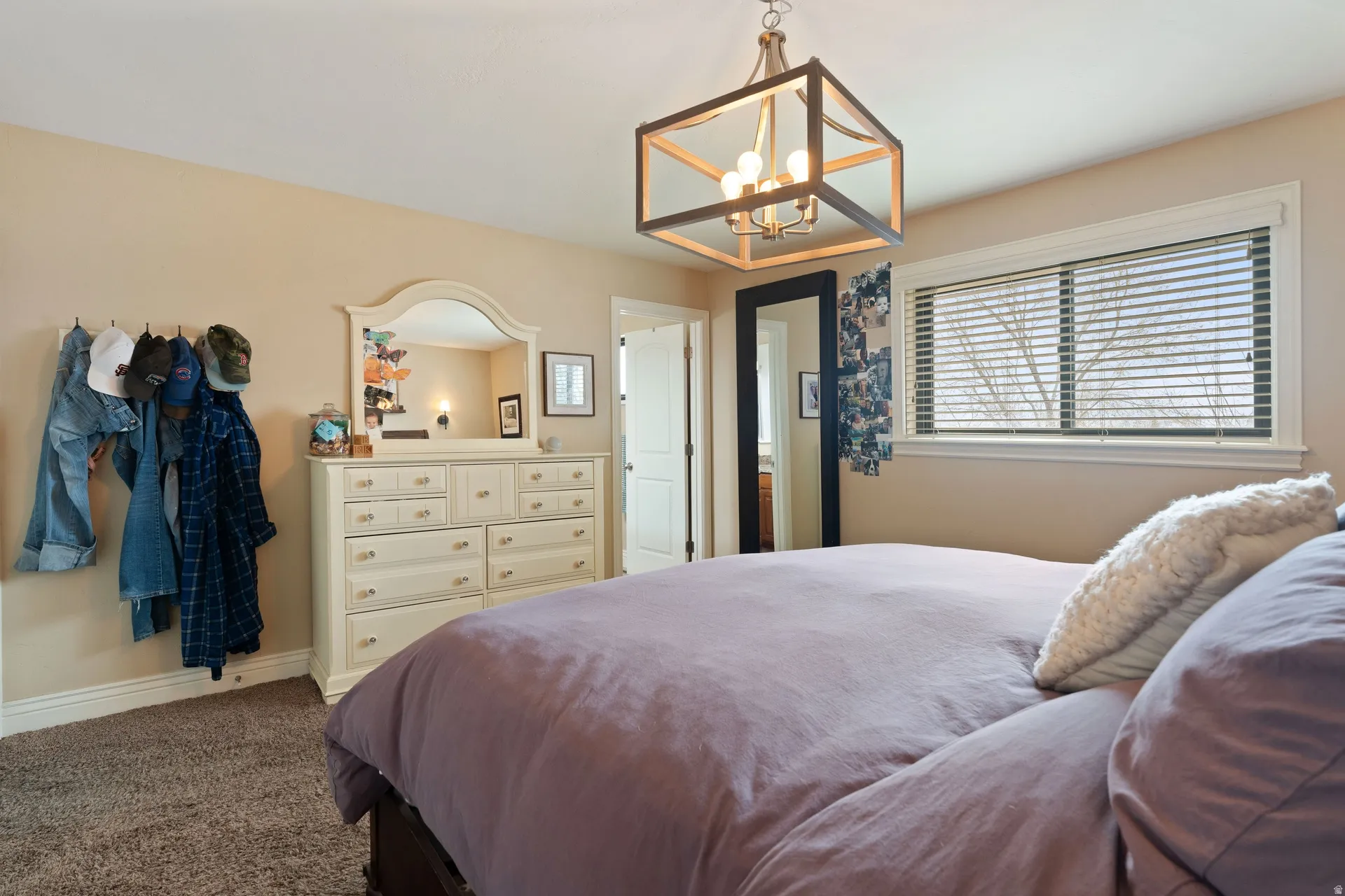 Open concept light fixture with a geometric wood and metal frame