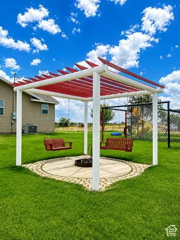 Outdoor pergola featuring white posts and red louvered roof