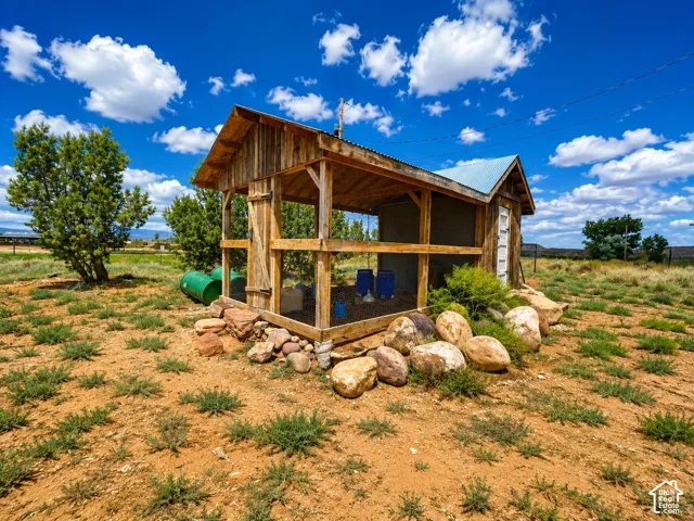 Rustic wooden outbuilding with a corrugated metal roof
