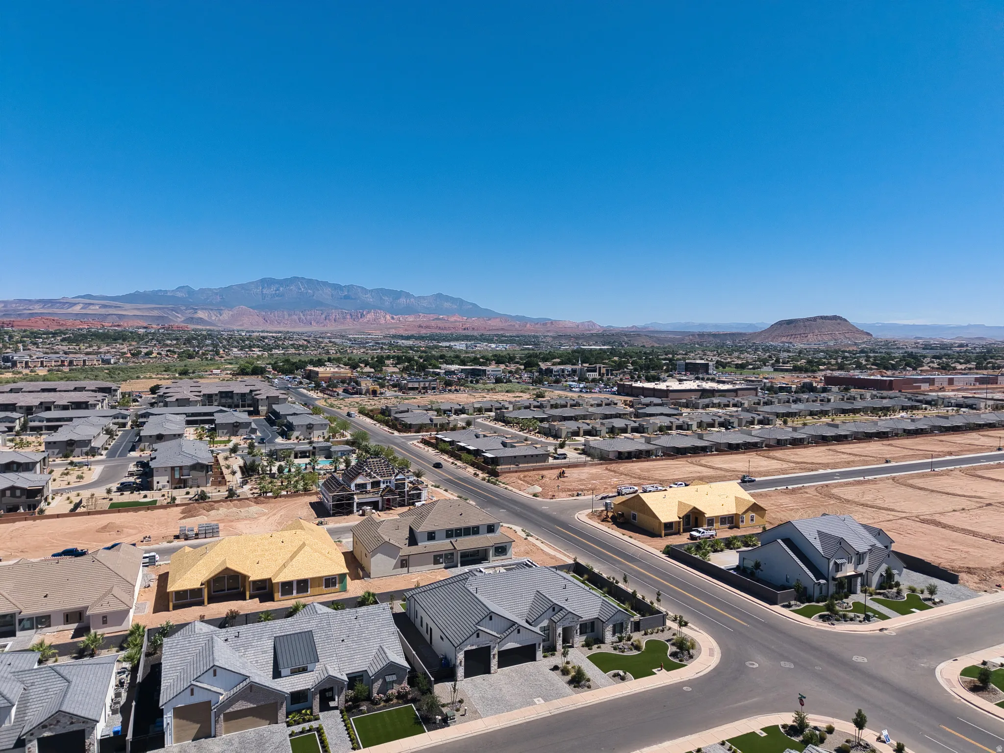 Aerial perspective showcasing a developing residential area with established homes and new construction