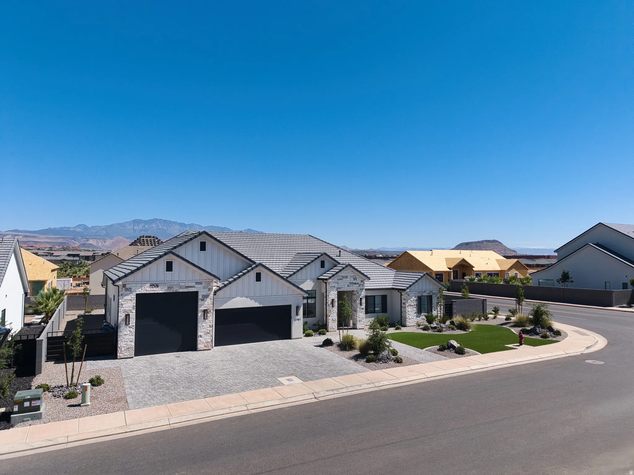 Contemporary single-level residence featuring a multi-gable roofline and integrated two-car garage
