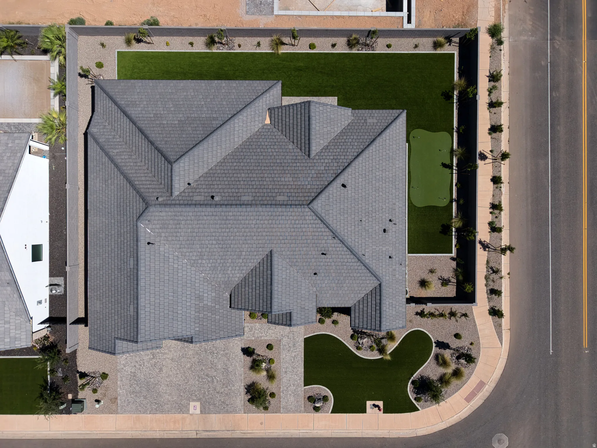 Modern grey shingle roofline with multiple gables