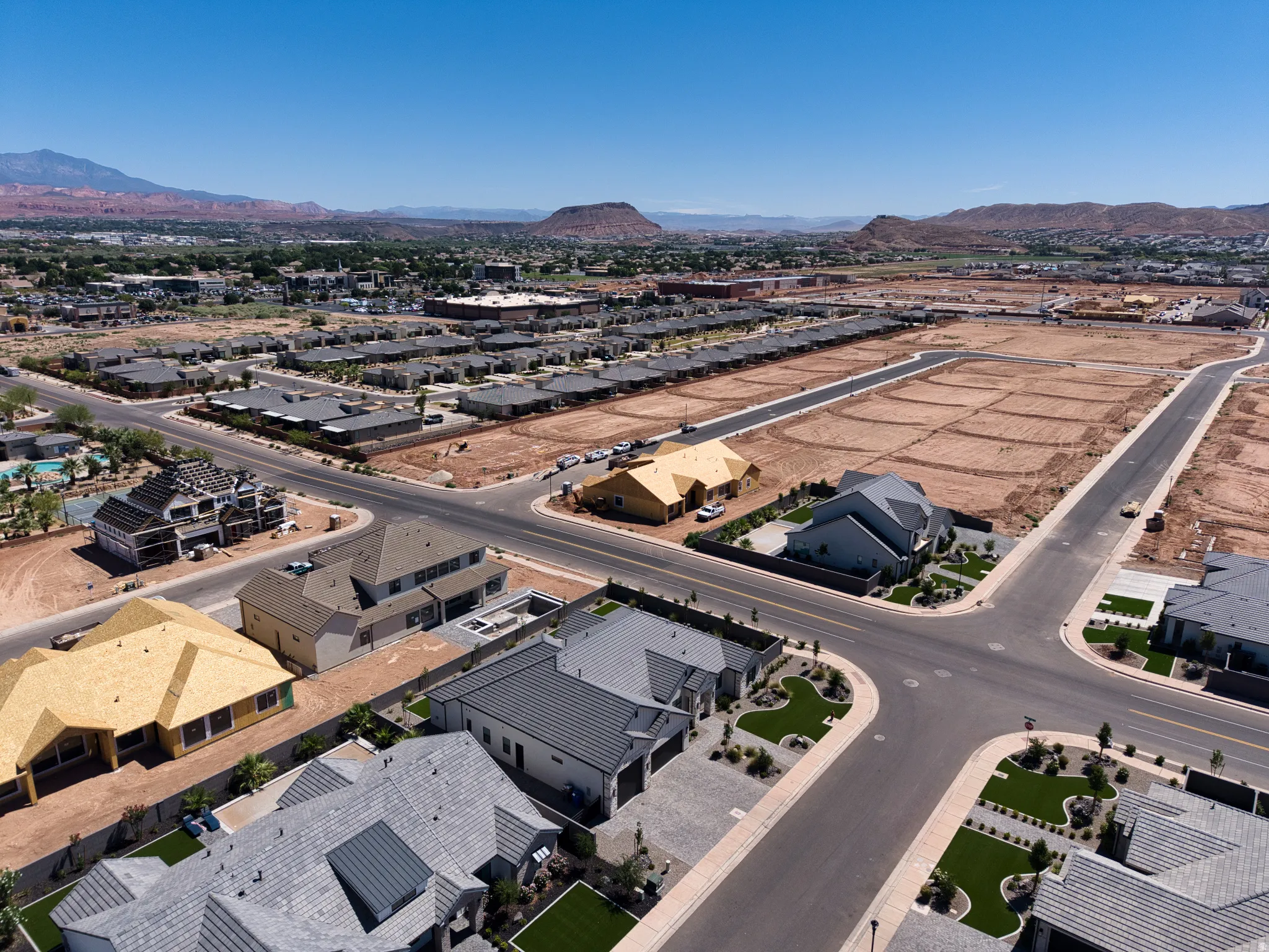 Residential development featuring paved streets and manicured landscaping
