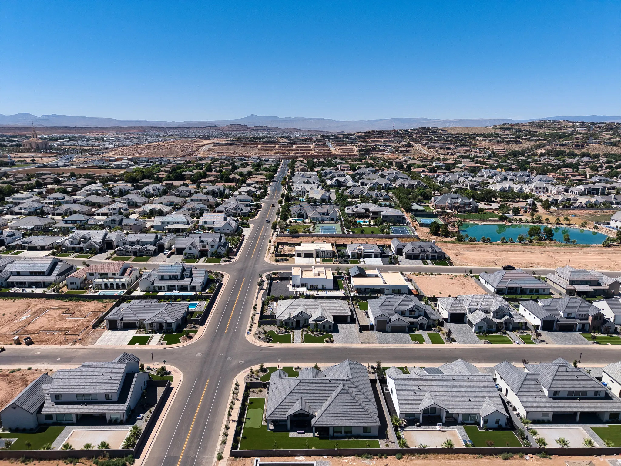Expansive aerial perspective showcasing a residential development with varied architectural styles