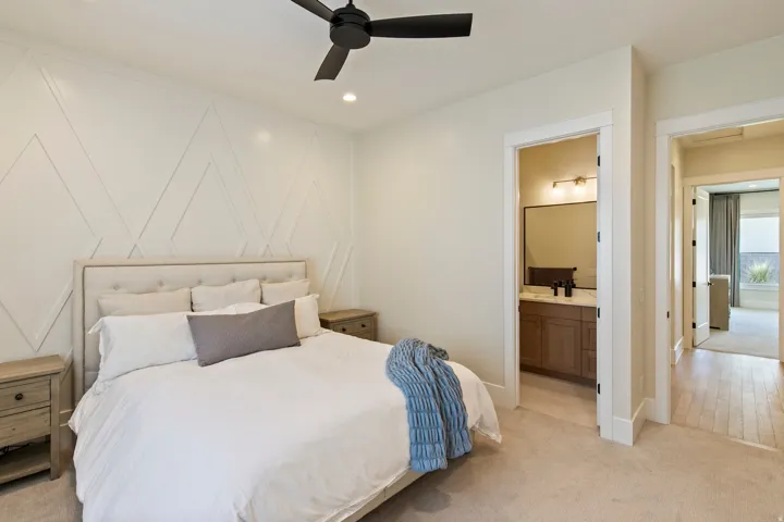Bedroom featuring a decorative accent wall, recessed lighting, and a ceiling fan