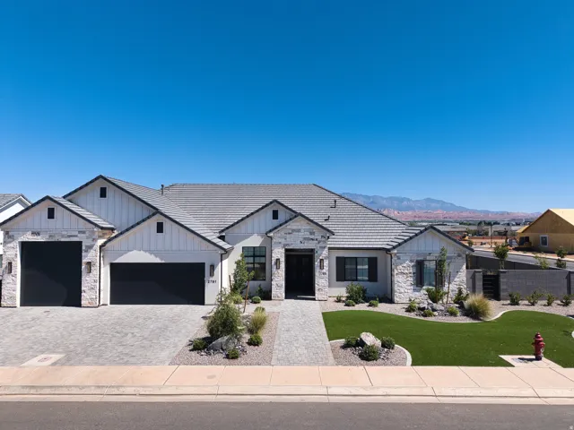 Modern single-story residence with a stone and board-and-batten facade