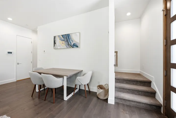 Hardwood-finish flooring extending from the entryway