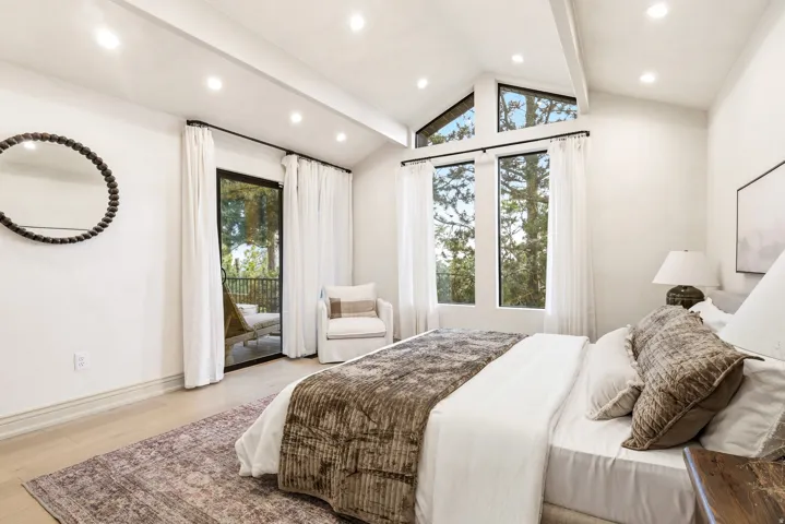 Vaulted ceiling with exposed beam and recessed lighting