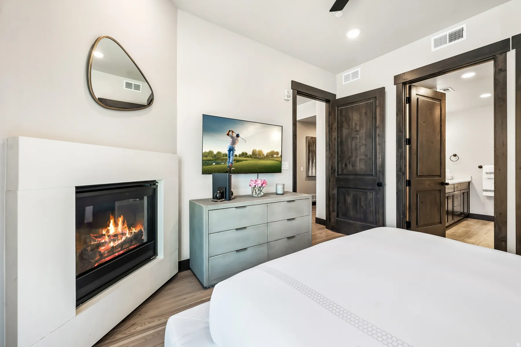 Modern fireplace with a white surround and a glass enclosure