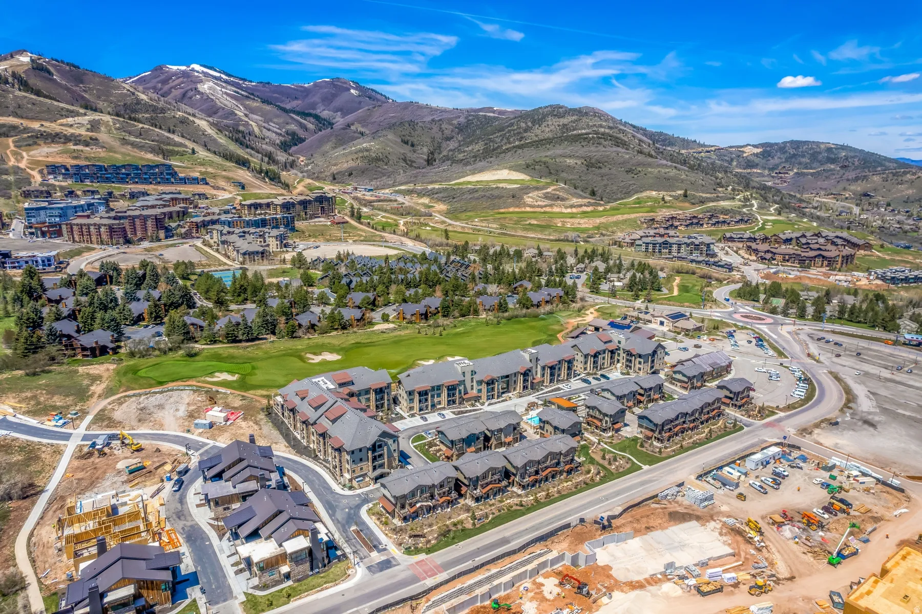 Aerial perspective showcasing a mountain community with diverse architectural styles