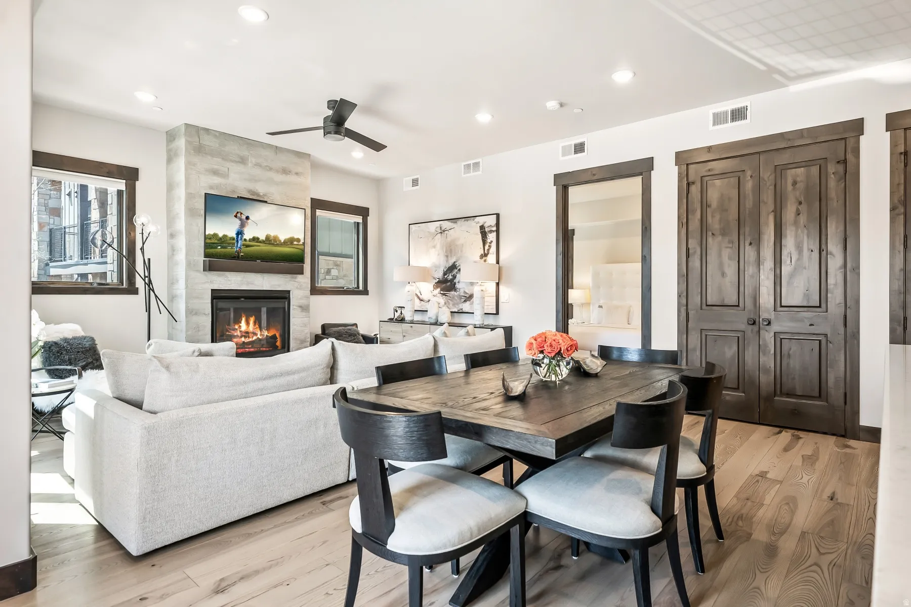 Open-concept living space featuring wood-finish flooring