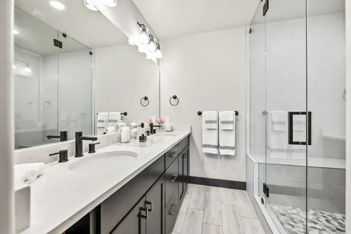 Dual vanity with integrated sinks and matte black fixtures