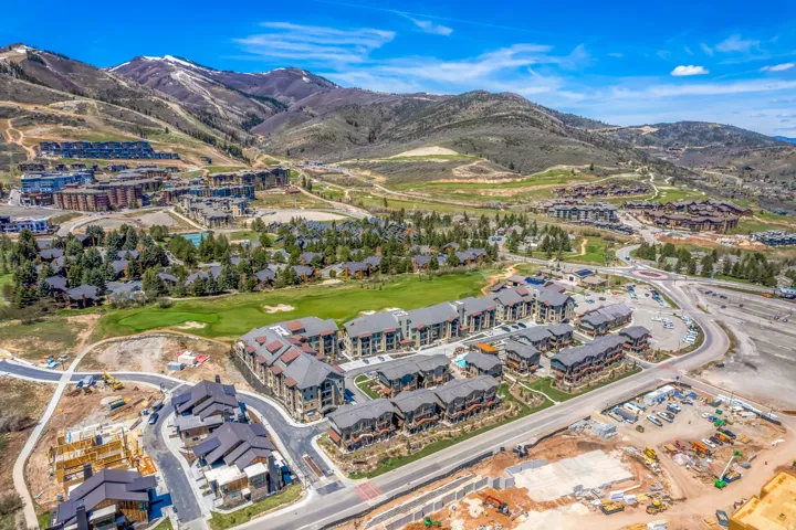 Aerial perspective showcasing a mountain community with diverse architectural styles