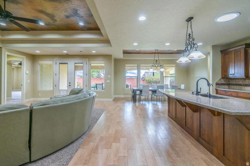 Spacious open-concept interior featuring light wood-finish flooring