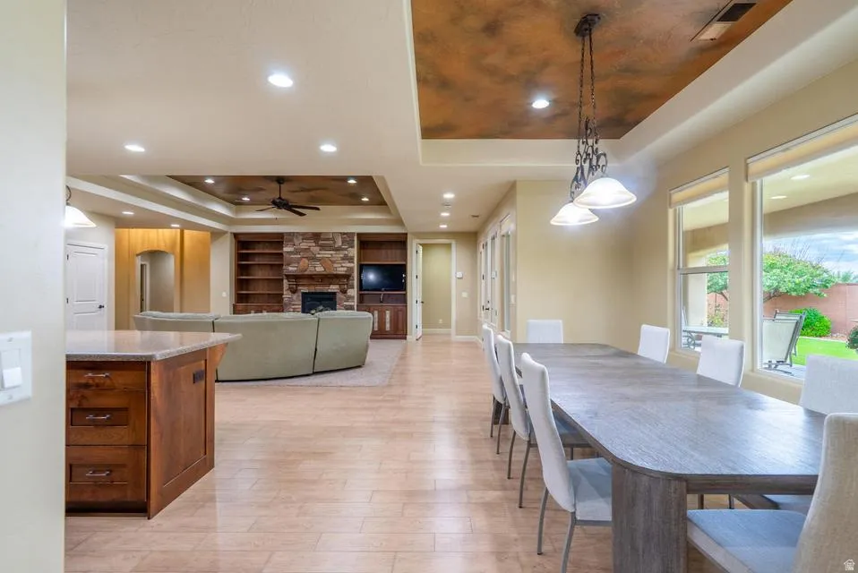 Open-concept living space featuring neutral-toned flooring throughout