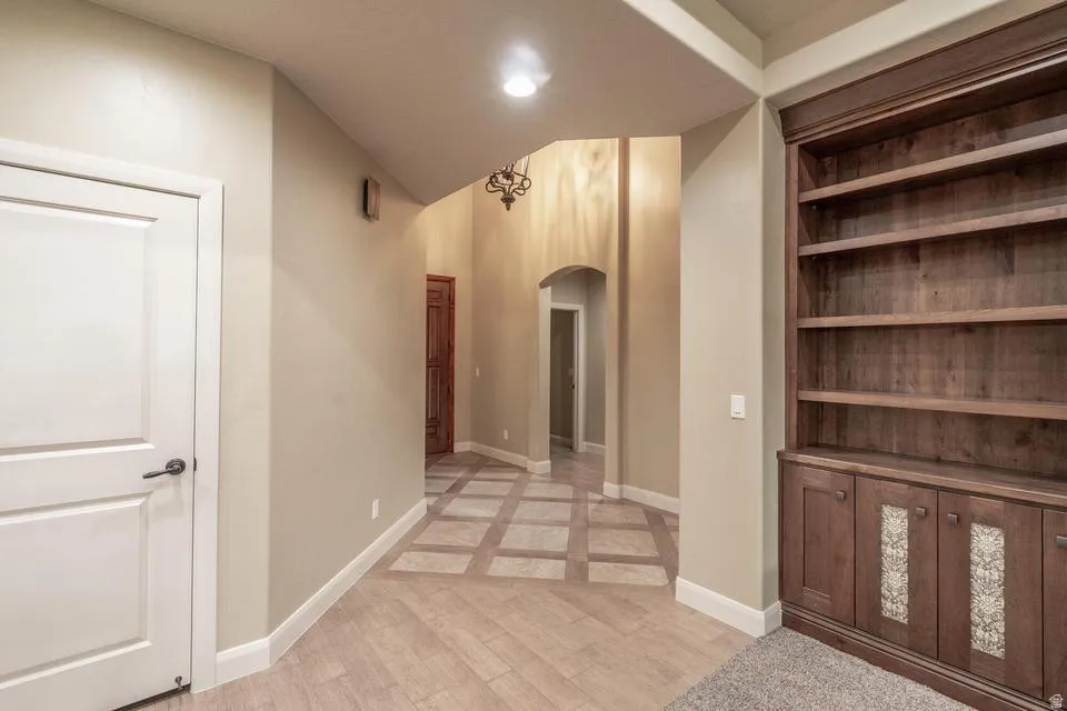 Built-in wood cabinetry with open shelving and lower storage