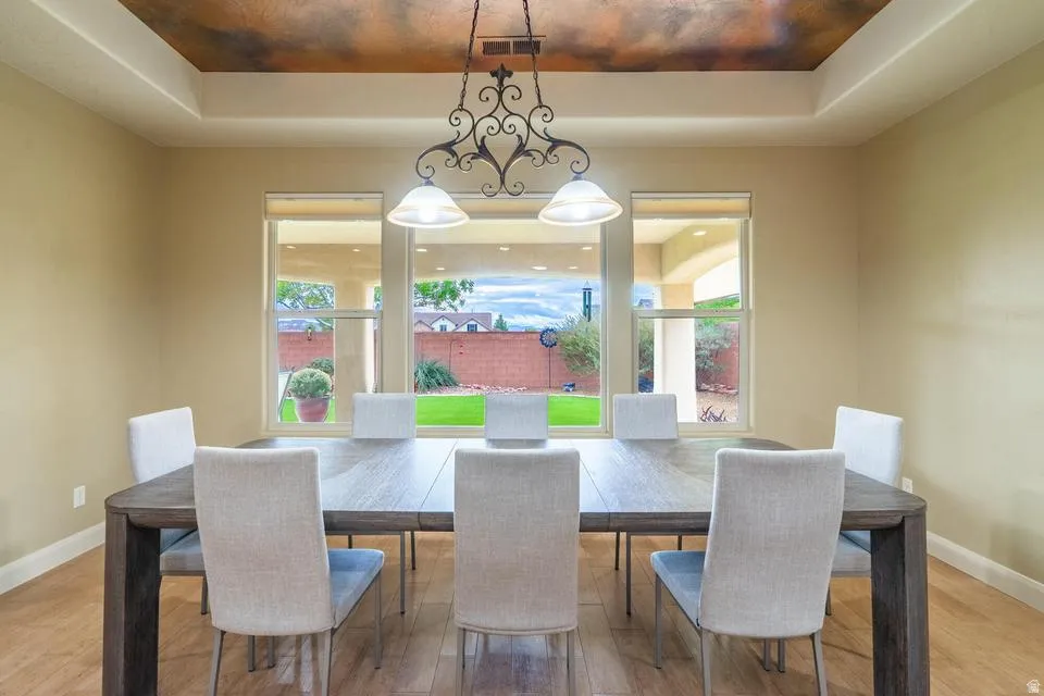 Dining area featuring light wood-finish flooring and neutral wall tones