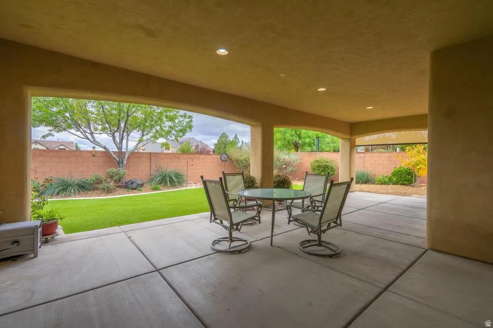 Spacious covered patio featuring recessed lighting and a concrete slab