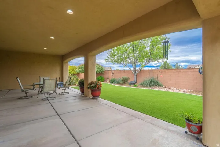 Covered patio featuring recessed lighting and a concrete slab floor