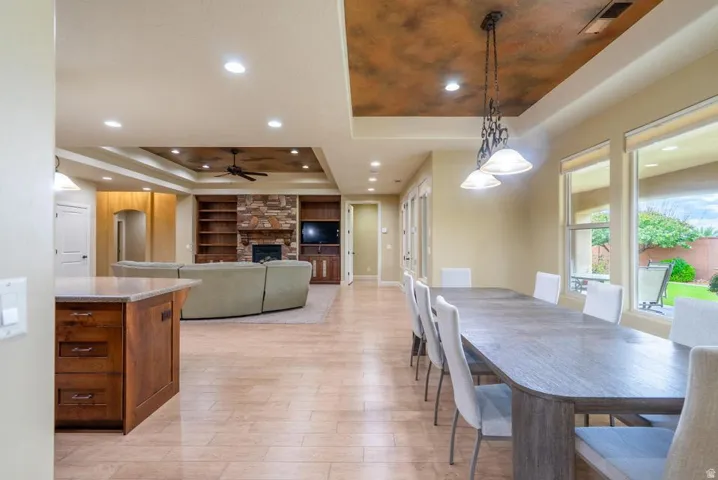 Open-concept living space featuring neutral-toned flooring throughout