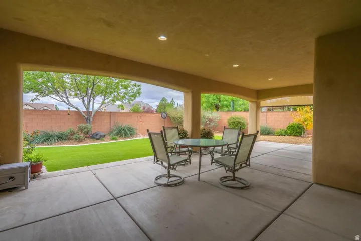 Spacious covered patio featuring recessed lighting and a concrete slab