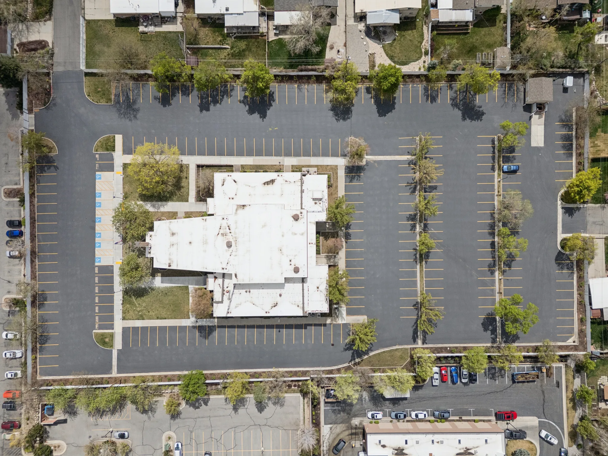Extensive paved parking lot surrounding the only structure on the property.
