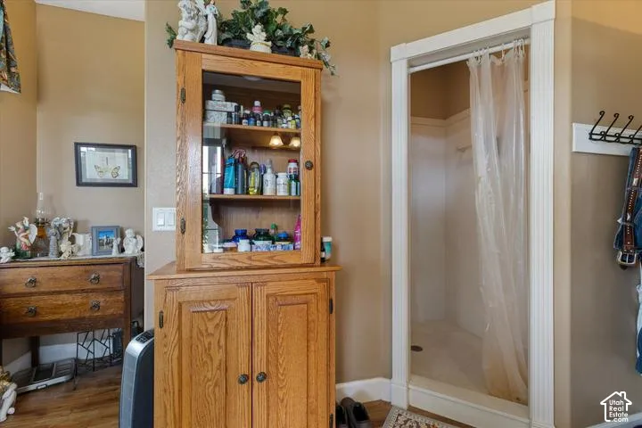 Walk-in shower with clear shower curtain and white trim