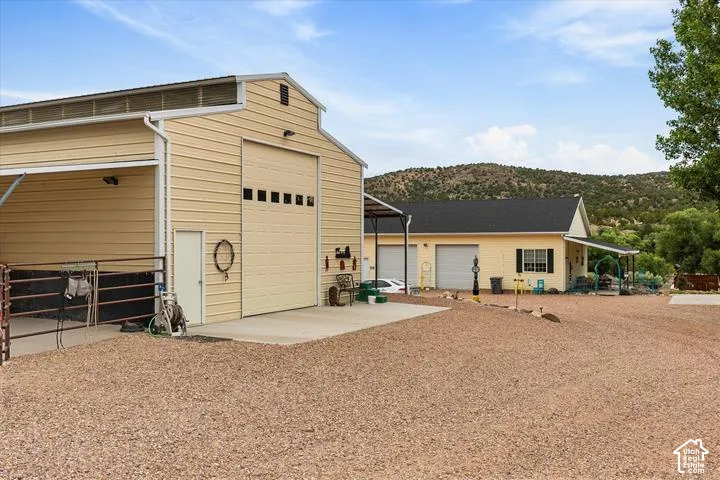 Expansive gravel driveway providing extensive parking and access to multiple buildings