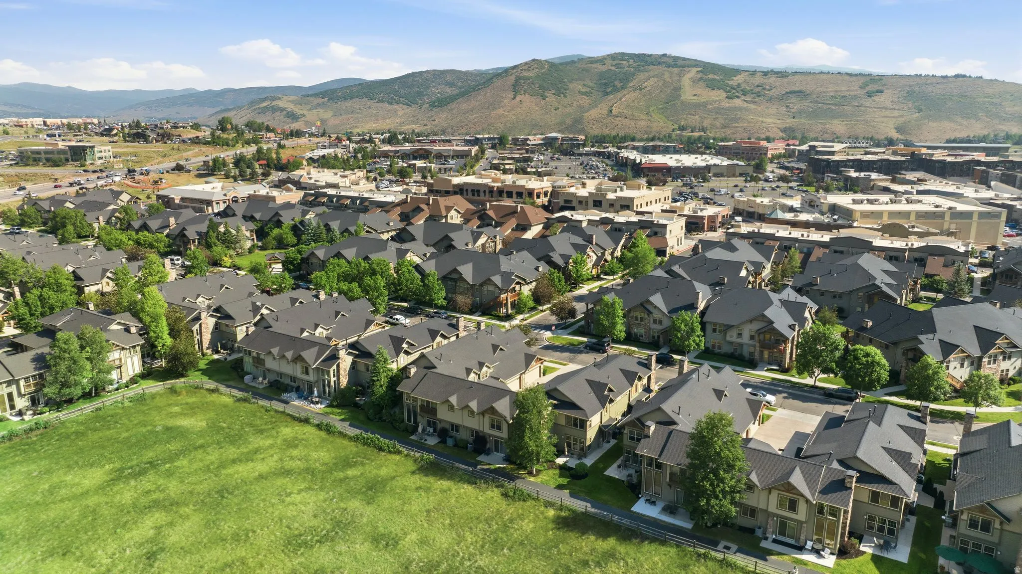 Aerial perspective showcasing a residential development with multiple detached and attached structures