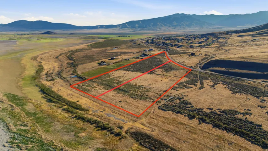 Expansive land parcels outlined in red, featuring natural vegetation and direct road frontage