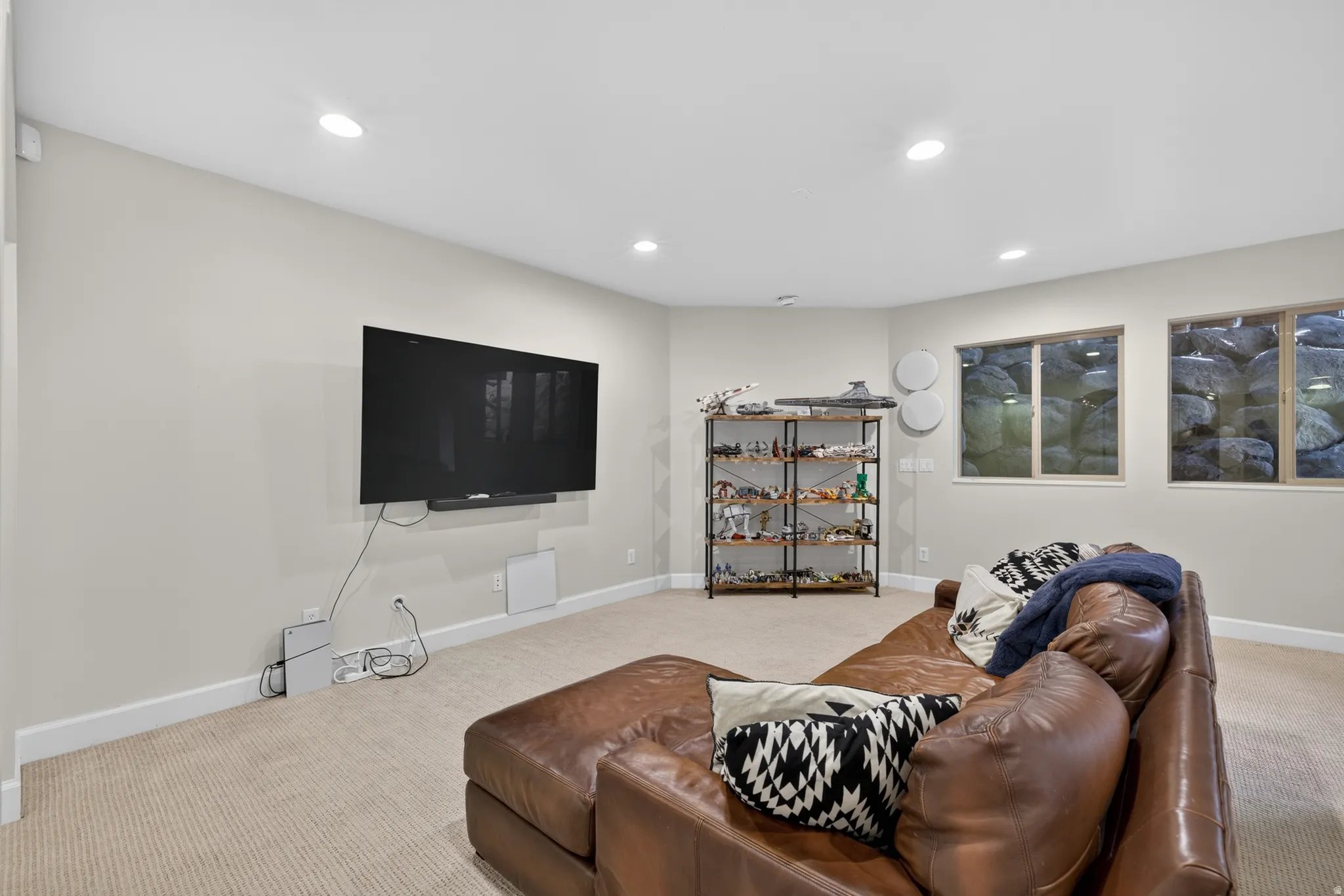 Carpeted room featuring recessed lighting and white baseboards