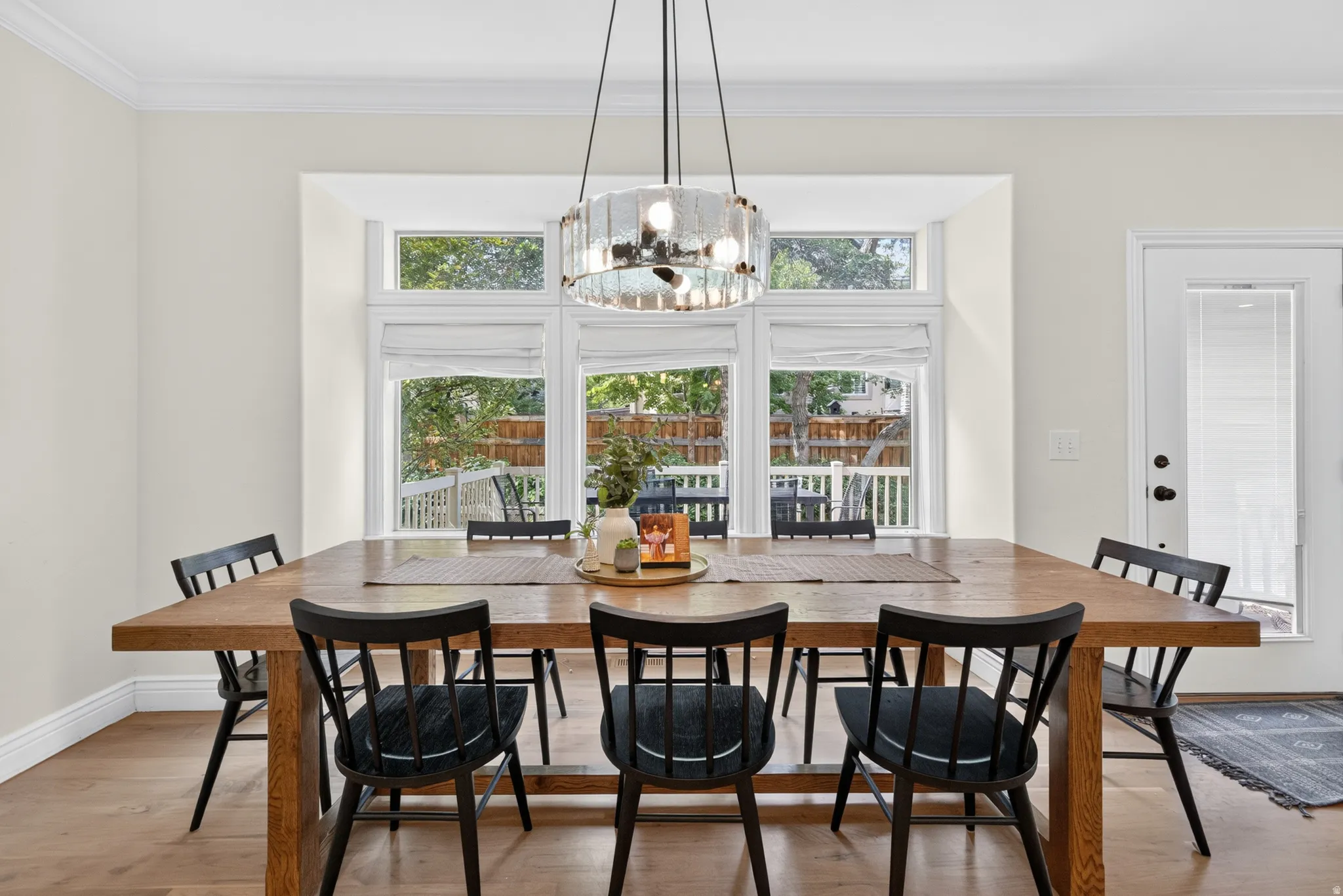 Dining area featuring a wood-finish dining table and wood-finish flooring