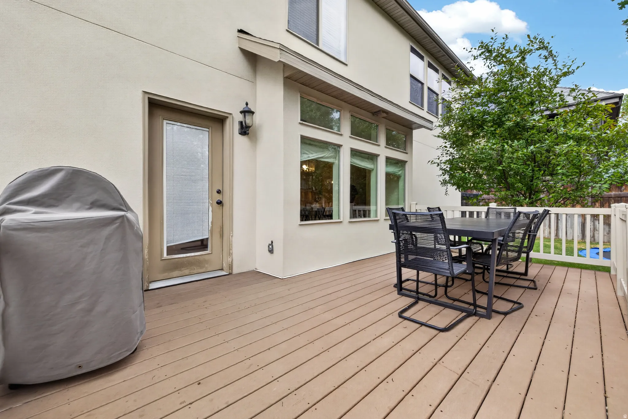 Expansive outdoor deck featuring wood-finish flooring