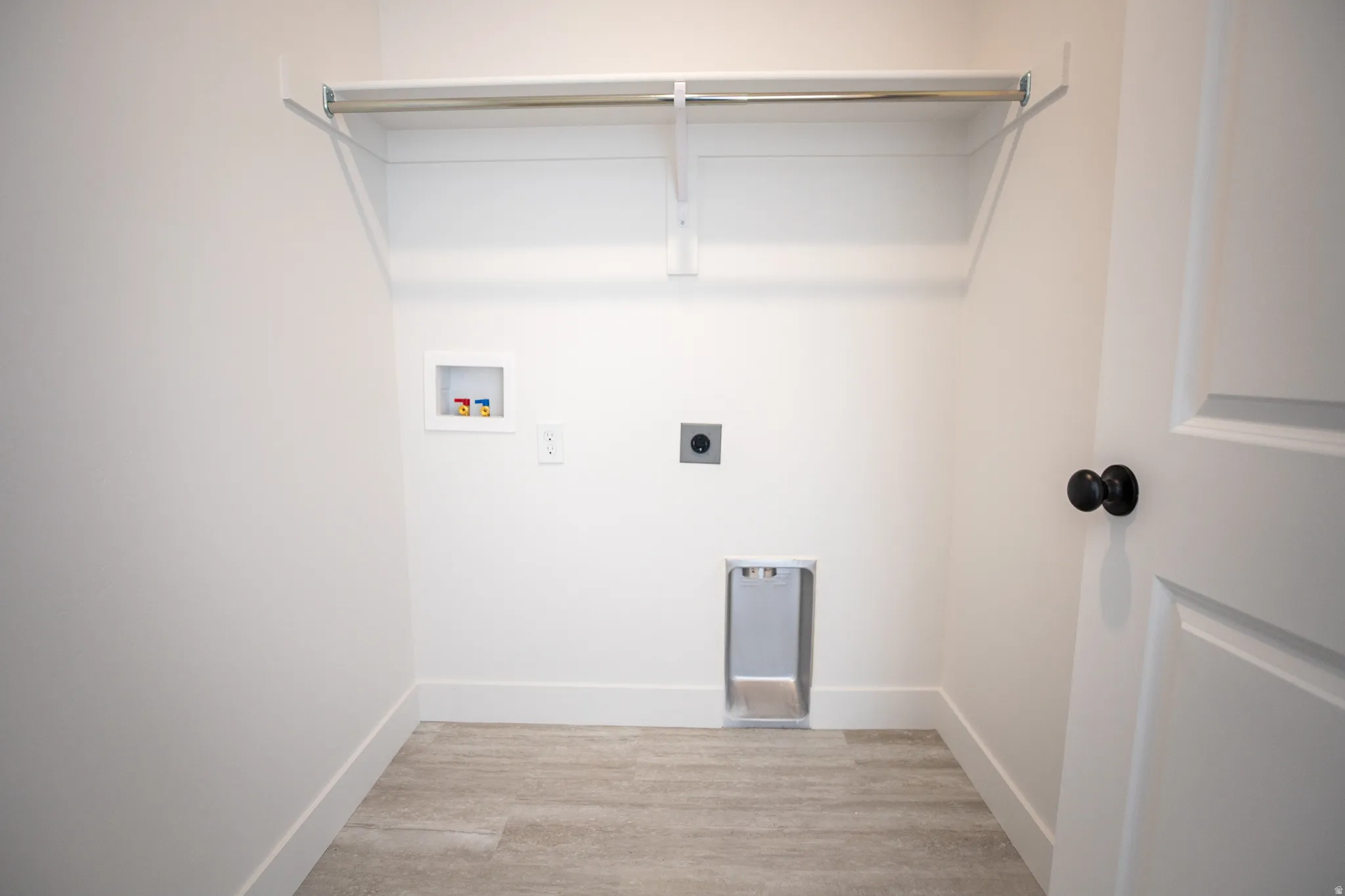 Laundry room with hookups for an electric washer and dryer
