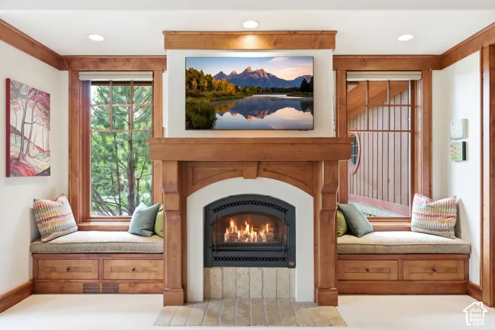 Custom wood-finish fireplace mantel with an arched firebox
