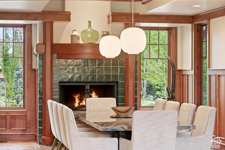 Fireplace with green tile surround and dark hearth
