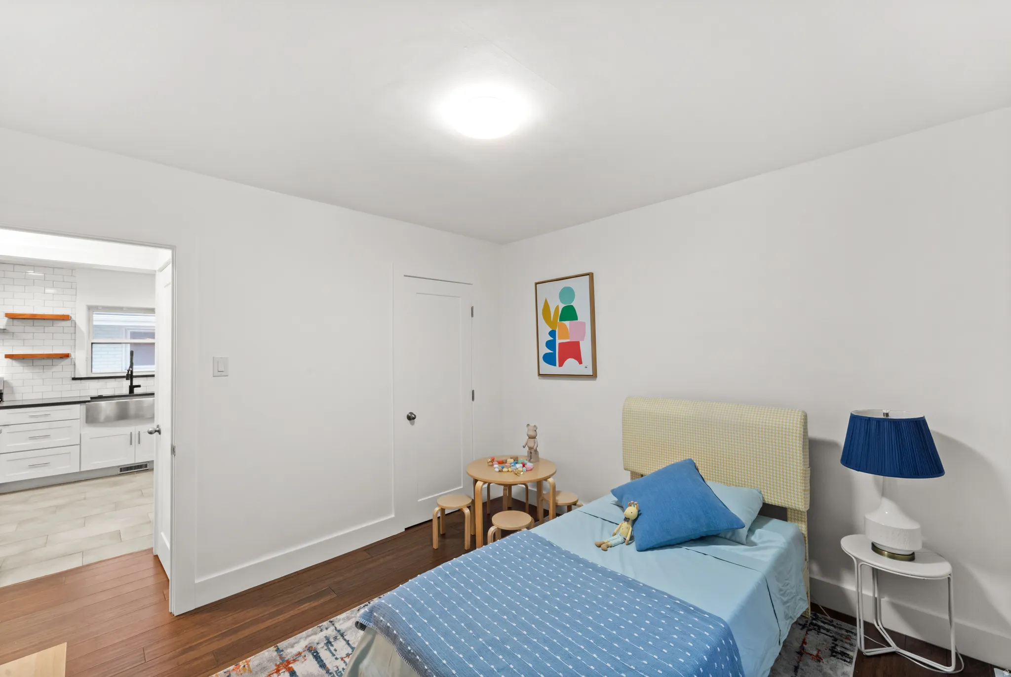 Rich wood-finish flooring complements white walls and trim