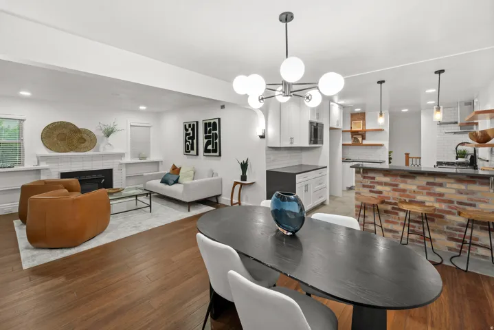 Open-concept living space featuring wood-finish flooring