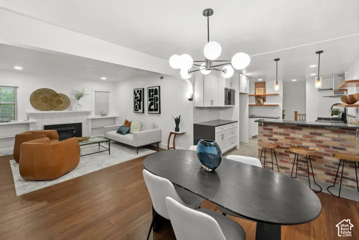 Open-concept living space featuring wood-finish flooring