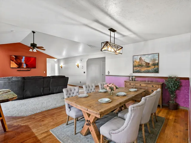 Open concept dining area featuring wood-finish flooring
