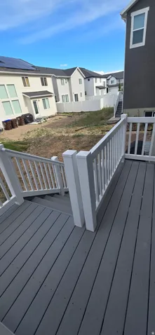 Composite decking with integrated white railing and stair system