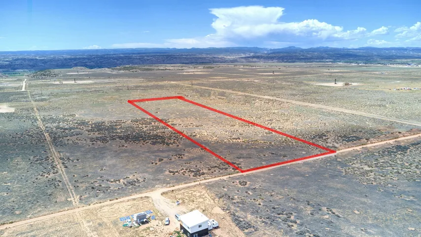 Expansive undeveloped land featuring a rectangular parcel outlined in red