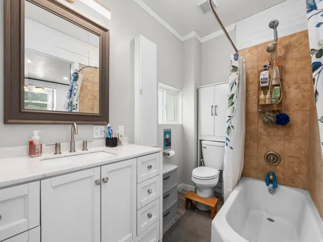 Bathroom vanity with a white countertop and integrated sink