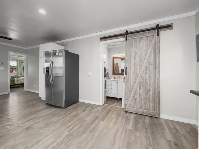 Light wood-finish flooring extending into the background