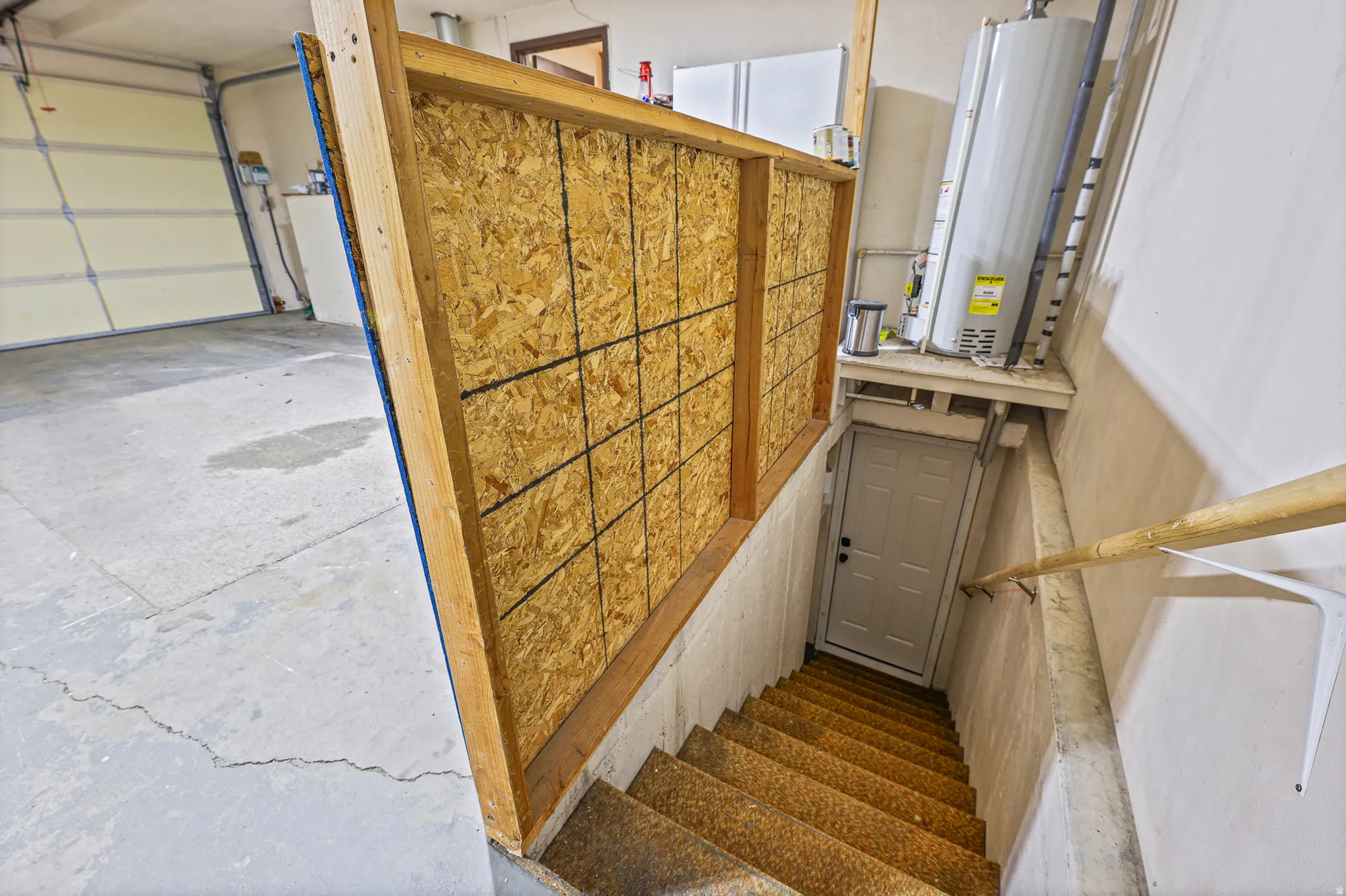 Basement entrance from garage with back door entry
