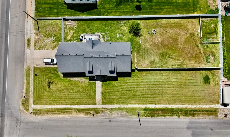 Property with expansive green spaces and a large, fenced rear yard