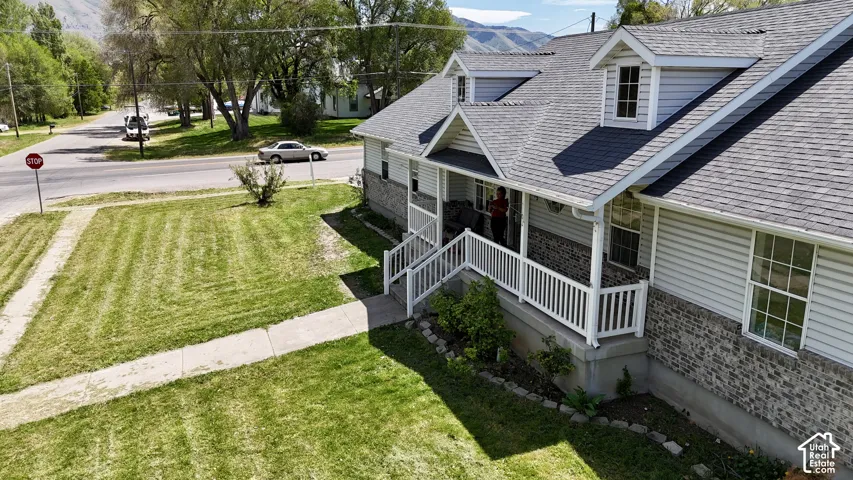 Charming exterior with gray siding and stone veneer