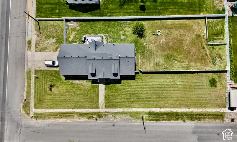 Property with expansive green spaces and a large, fenced rear yard