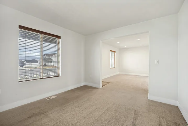 Interior space featuring light-toned carpeting and white walls