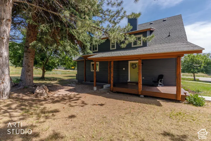 Charcoal siding exterior with a dark shingle roof